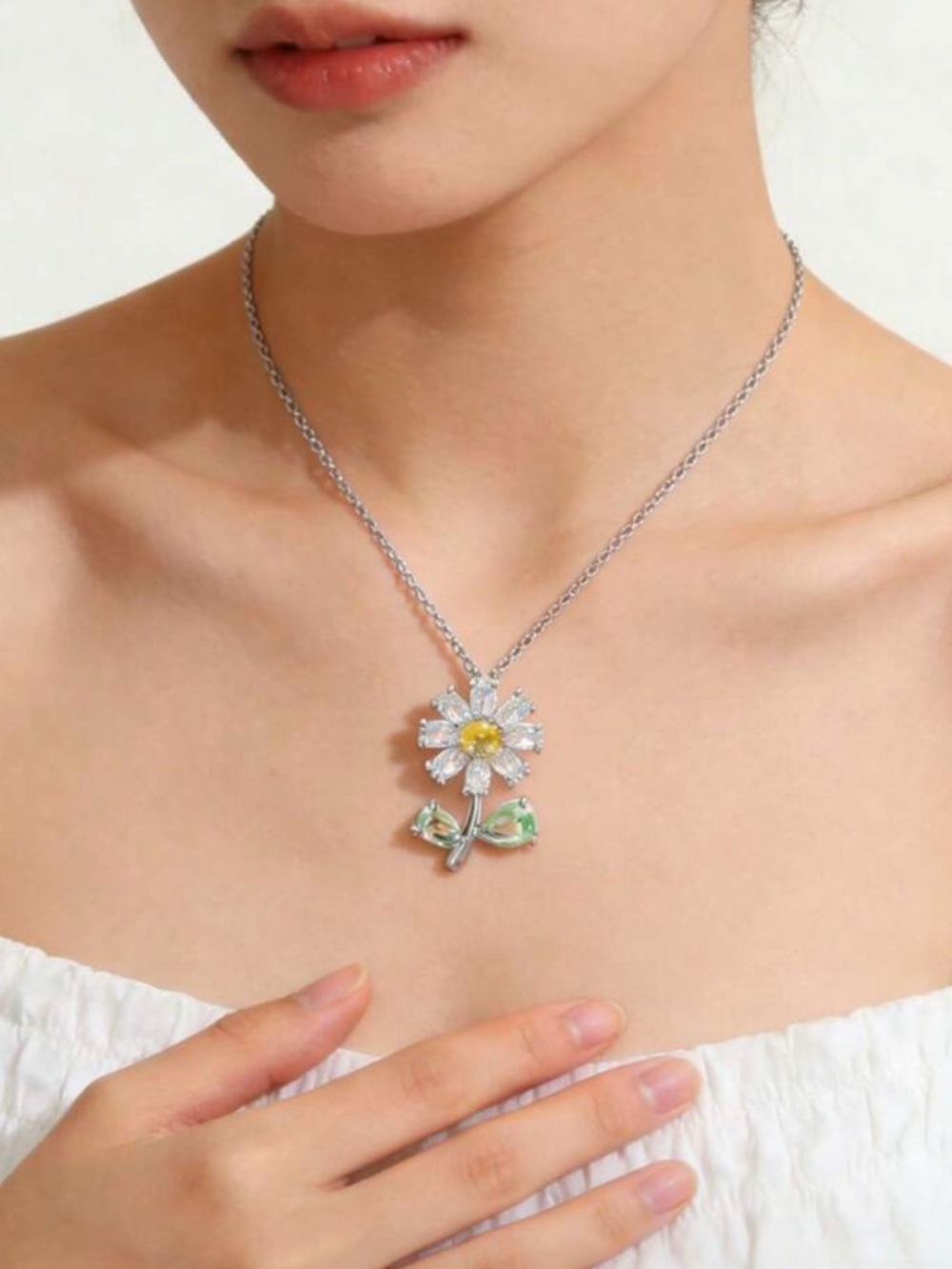 Silver Daisy Pendant Necklace with Yellow Center and Green Leaves